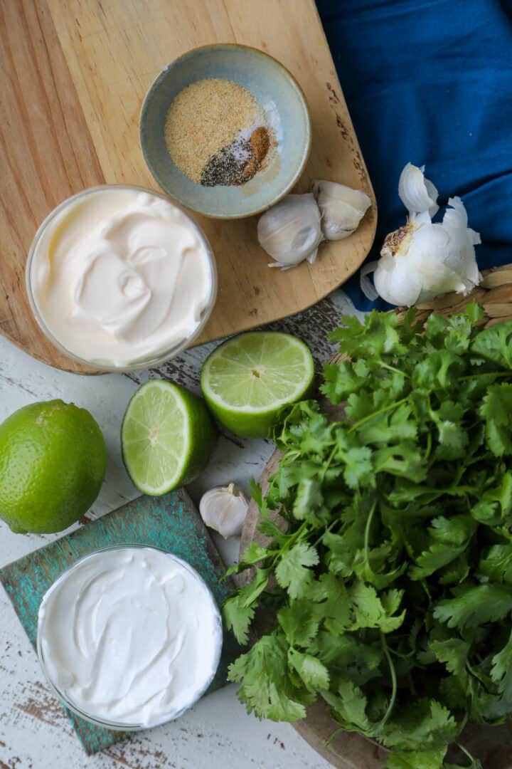 flat lay of all the ingredients needed for cilantro garlic lime sauce