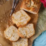 cheesy beer bread sliced over parchment paper