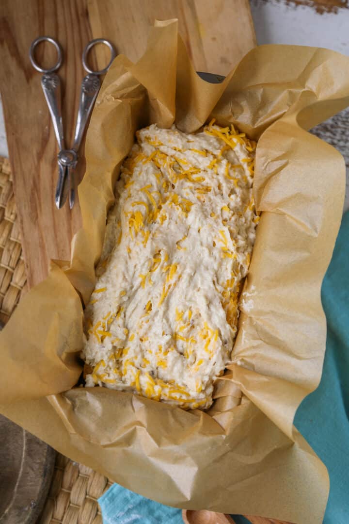 cheesy beer bread batter in loaf pan 