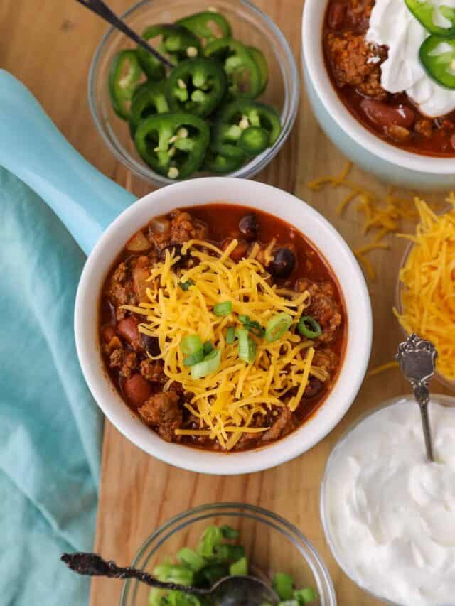 Beer Chorizo and beef chili on a wooden surface.